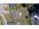 Overhead view of home with a private dock, backyard, and lake access at 130 Islabella Way, Groveland, FL 34736