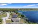 Lakefront home featuring lush landscaping and lake views at 130 Islabella Way, Groveland, FL 34736