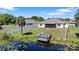 Aerial shot of backyard featuring private dock and lake access; great for water enthusiasts at 130 Islabella Way, Groveland, FL 34736