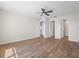 Spacious bedroom with hardwood floors and a ceiling fan at 130 Islabella Way, Groveland, FL 34736