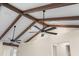 Vaulted ceiling with exposed beams and fans at 130 Islabella Way, Groveland, FL 34736