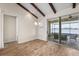 Dining area with tile floors, lake views, and access to a screened lanai at 130 Islabella Way, Groveland, FL 34736