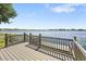 Scenic view from the wooden dock showcasing tranquil lake waters and natural beauty at 130 Islabella Way, Groveland, FL 34736