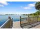 Charming wooden dock, perfect for serene lakeside moments and enjoying the picturesque water views at 130 Islabella Way, Groveland, FL 34736
