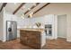 Stylish kitchen with stainless appliances, granite countertops, and an island with bar seating at 130 Islabella Way, Groveland, FL 34736