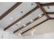 Close up view of the pendant lighting and wood beams in the kitchen at 130 Islabella Way, Groveland, FL 34736