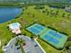 Community pool, tennis courts and clubhouse offer luxurious amenities for residents at 14230 Sunriver Ave, Orlando, FL 32828