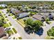 Aerial view of neighborhood with beautiful landscaping, showcasing the home's curb appeal and community setting at 14230 Sunriver Ave, Orlando, FL 32828