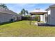 Property featuring cozy backyard and covered gazebo at 14230 Sunriver Ave, Orlando, FL 32828