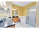 Spacious bathroom with double vanity, bathtub, and enclosed shower at 14230 Sunriver Ave, Orlando, FL 32828