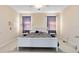 A well lit bedroom featuring neutral walls, ceiling fan and a comfortable looking bed at 14230 Sunriver Ave, Orlando, FL 32828