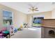 Bright bonus room with natural light from the window, ceiling fan, and access to the outdoors at 14230 Sunriver Ave, Orlando, FL 32828