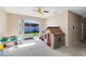 Bonus room with a sliding glass door to the backyard, filled with light and perfect for play at 14230 Sunriver Ave, Orlando, FL 32828