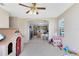 Bonus room with an open archway to the kitchen, flooded with light and perfect for playtime at 14230 Sunriver Ave, Orlando, FL 32828