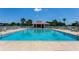 Sparkling community pool, perfect for relaxation and recreation, with plenty of lounge seating and shade at 14230 Sunriver Ave, Orlando, FL 32828