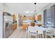 Spacious kitchen with stainless steel appliances, tile flooring, and an open layout, ideal for cooking and dining at 14230 Sunriver Ave, Orlando, FL 32828