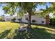 The property features a tree swing and backyard at 14230 Sunriver Ave, Orlando, FL 32828
