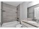 Bathroom features updated sink with granite countertop, bathtub, and tiled shower at 14978 Sw 24Th Cir, Ocala, FL 34473