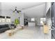 Open-concept kitchen, stainless steel appliances, granite countertops, gray cabinets at 14978 Sw 24Th Cir, Ocala, FL 34473
