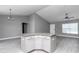 Open-concept features kitchen island with granite countertops in the main living area at 14978 Sw 24Th Cir, Ocala, FL 34473