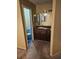 Modest bathroom with a toilet, sink, and vanity at 1510 Massa St, Kissimmee, FL 34744