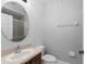 Bright bathroom featuring a stylish vanity, toilet, and walk-in shower at 1563 Common Way Rd, Orlando, FL 32814