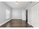Well-lit bedroom featuring wood floors, closet, and a window providing natural light at 1563 Common Way Rd, Orlando, FL 32814