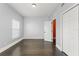 Bedroom with hardwood floors, closet and window with blinds at 1563 Common Way Rd, Orlando, FL 32814