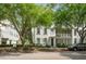 Street view of an attractive two-story townhouse with a covered porch and well-maintained landscaping at 1563 Common Way Rd, Orlando, FL 32814