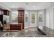Bright kitchen with granite counters, stainless steel appliances, and a door to the outside at 1563 Common Way Rd, Orlando, FL 32814