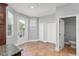Bright kitchen area with access to the patio and a half bathroom at 1563 Common Way Rd, Orlando, FL 32814