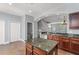 Spacious kitchen with granite counters, stainless steel appliances, and convenient island at 1563 Common Way Rd, Orlando, FL 32814