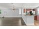Modern kitchen featuring stainless steel appliances, granite countertops, and rich wood cabinetry at 1563 Common Way Rd, Orlando, FL 32814