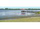 Scenic view of a pier with gazebo extending into the tranquil lake at 1563 Common Way Rd, Orlando, FL 32814