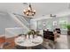 Elegant living room featuring a dining area, hardwood floors and great natural light at 1563 Common Way Rd, Orlando, FL 32814