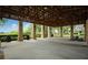 Spacious pavilion with picnic tables overlooking the serene lake at 1563 Common Way Rd, Orlando, FL 32814