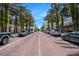 View of a town center lined with palm trees with local shops and restaurants at 1563 Common Way Rd, Orlando, FL 32814