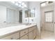 Bright bathroom featuring a long vanity with marble countertop and tile flooring at 160 Archers Pt., Longwood, FL 32779