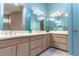 Well-lit bathroom features dual sinks, vanity, and modern fixtures at 160 Archers Pt., Longwood, FL 32779