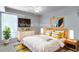 Stylishly staged bedroom with modern furnishings, a mounted TV, and a warm, inviting atmosphere at 160 Archers Pt., Longwood, FL 32779