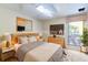 Comfortable bedroom with a large window, modern decor, and a cozy ambiance at 160 Archers Pt., Longwood, FL 32779