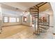 Spacious living area with spiral staircase, tile flooring, and an open floor plan at 160 Archers Pt., Longwood, FL 32779