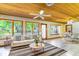 Bright living room features hardwood ceilings, lots of natural light, and comfortable seating at 160 Archers Pt., Longwood, FL 32779