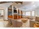 Cozy living room with vaulted ceilings, built-in shelves, and comfortable seating arrangement at 160 Archers Pt., Longwood, FL 32779
