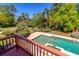 Backyard view of a private pool and lush landscaping from the upper deck at 160 Archers Pt., Longwood, FL 32779