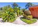 Beautifully landscaped yard with lush greenery and a winding walkway at 160 Archers Pt., Longwood, FL 32779