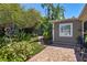 Beautiful backyard with brick floors, lush greenery and landscaping, and lots of sunlight at 1621 Chippewa Trl, Maitland, FL 32751