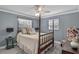 Comfortable bedroom with natural light, ceiling fan, and neutral walls at 1621 Chippewa Trl, Maitland, FL 32751