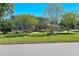 Beautiful home featuring a well-manicured lawn, mature landscaping, and a welcoming facade at 1621 Chippewa Trl, Maitland, FL 32751