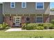 Close up of home's entrance with a brick facade and manicured front garden at 1621 Chippewa Trl, Maitland, FL 32751